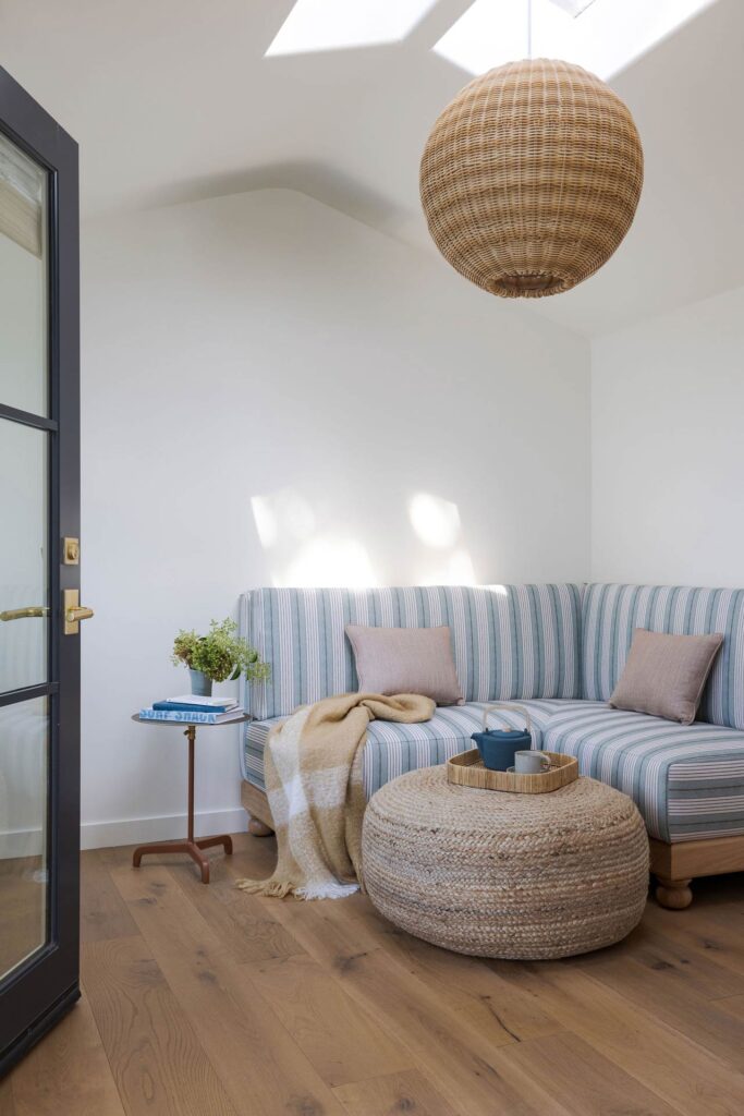 cozy sofa in corner with rattan pendant lamp